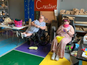 Photo of two Creative Foundations clients crocheting